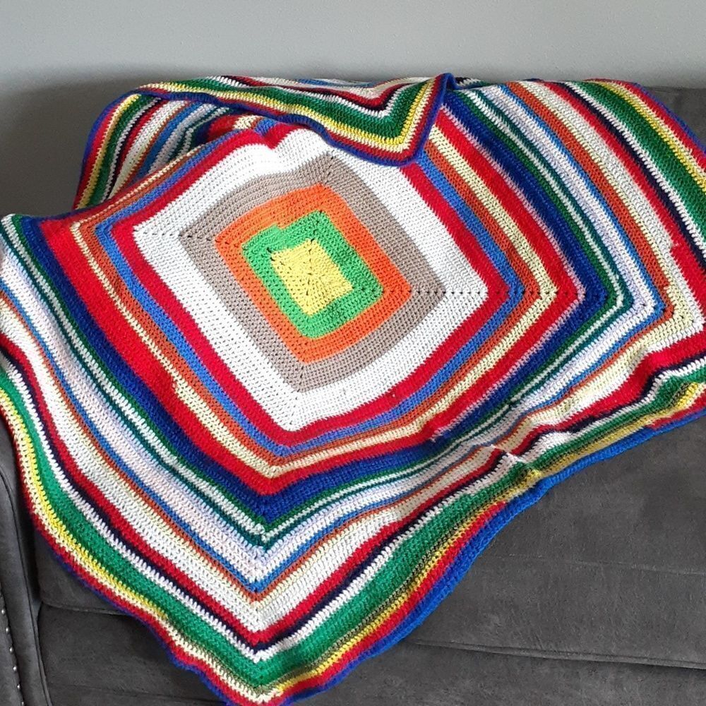 Beautiful hand crocheted 50" X 51" afghan‎
